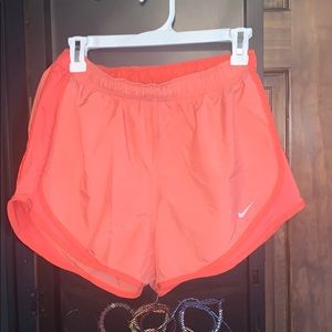 bright coral nike tempo running shorts